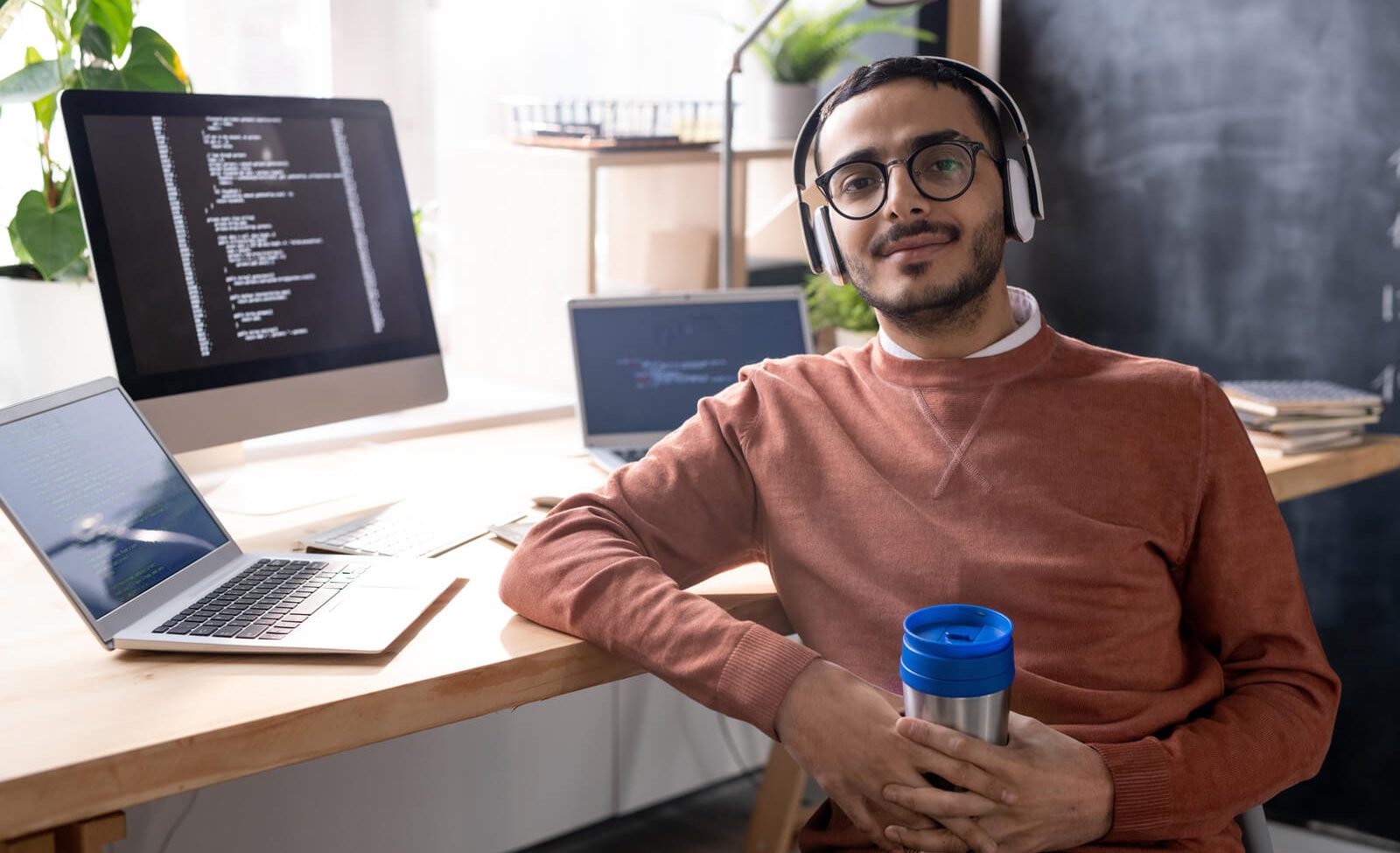 handsome programmer in headphones listening to mus 2023 11 27 04 56 48 utc
