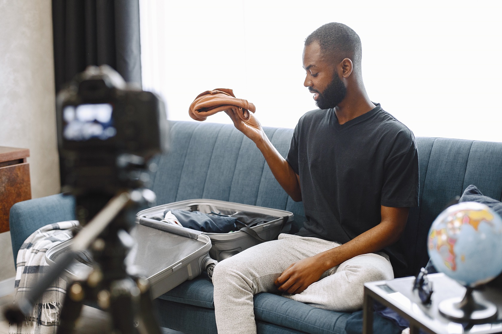 african male blogger recording vlog on digital cam kmqe9f5.jpg